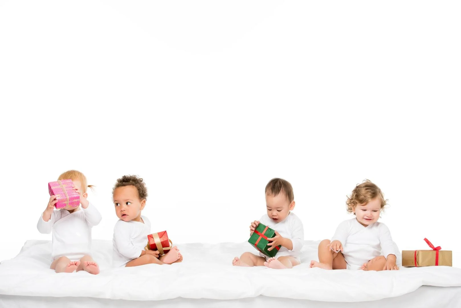 Children opening Christmas presents together.